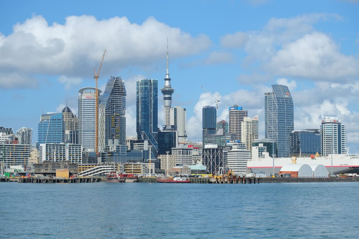Auckland's skyline and the Sky Tower rising above the harbour on a bright day